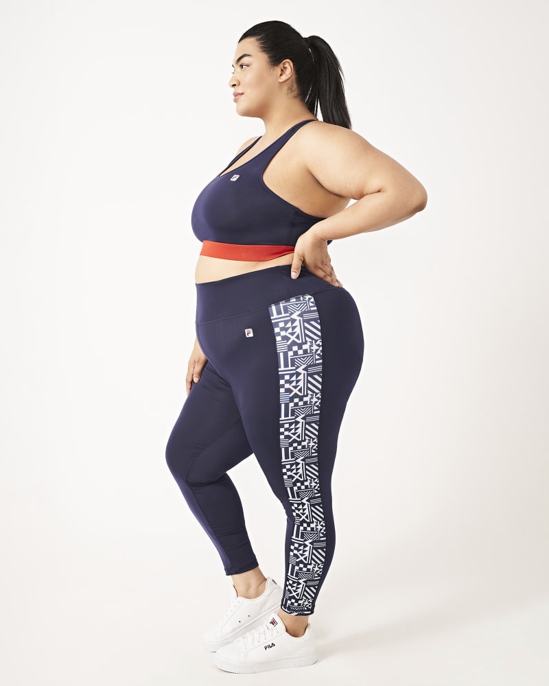 Plus size model with hourglass body shape wearing Anne Cropped Legging by FILA | Dia&Co | dia_product_style_image_id:160816